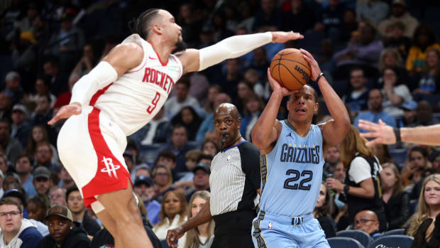 Grizzlies guard Desmond Bane shoots for three as Houston Rockets forward Dillon Brooks (9) defends during the first half at FedExForum.